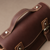 AI-assisted editorial presentation of the brown satchel - leather-detail