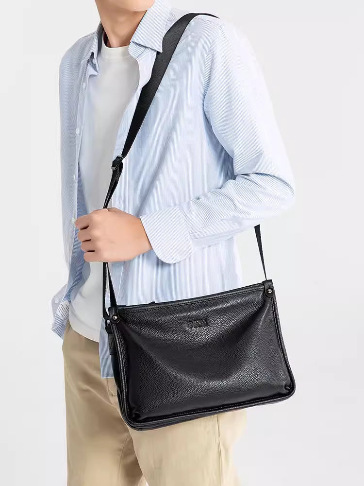 Man wearing a black leather messenger bag crossbody