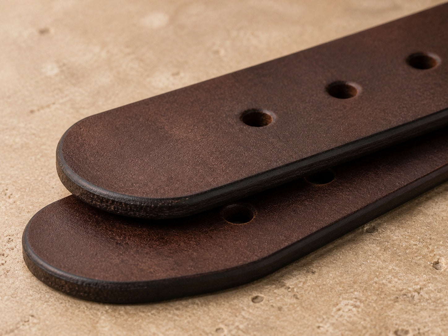 Smooth dark edges and clean holes on a wide waxed leather strap